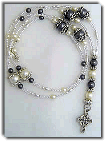 Gray and White Beaded Necklace with Cross